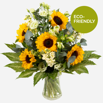 Sunny Spells  - Sunshine, showers and beautiful flowers … The magnificent sunflower with an attendance of beautiful blossoms to complement, upheld with bright foliage.
