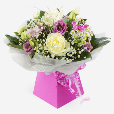 Penelope - A petite hand tied of pastel flowers makes a lovely gift for any occasion.
