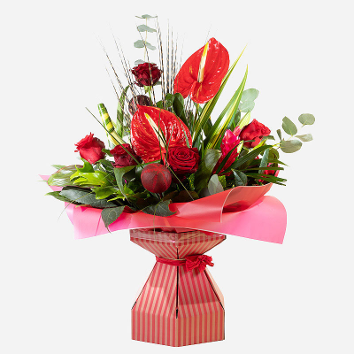 Power of Love - Show the power of ‘your’ love by sending this exquisite arrangement to that special person in your life. Infused with red roses,  tropical flowers and foliage, this stunning composition is all you need to show them how much they mean to you. PLEASE NOTE: this product may not be possible for same day delivery.
